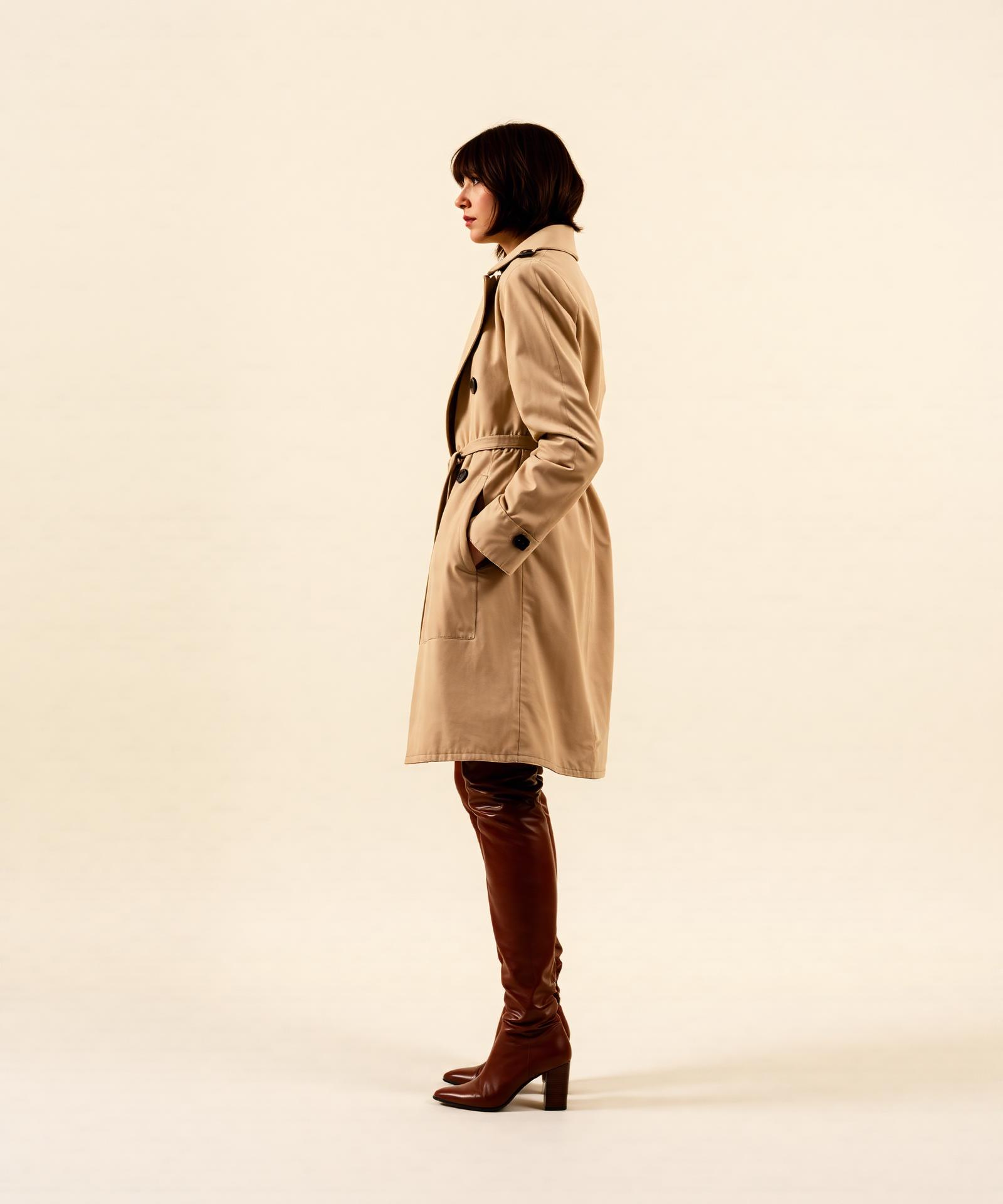 Model in cream coat and cognac boots from the Fall Winter 26 collection